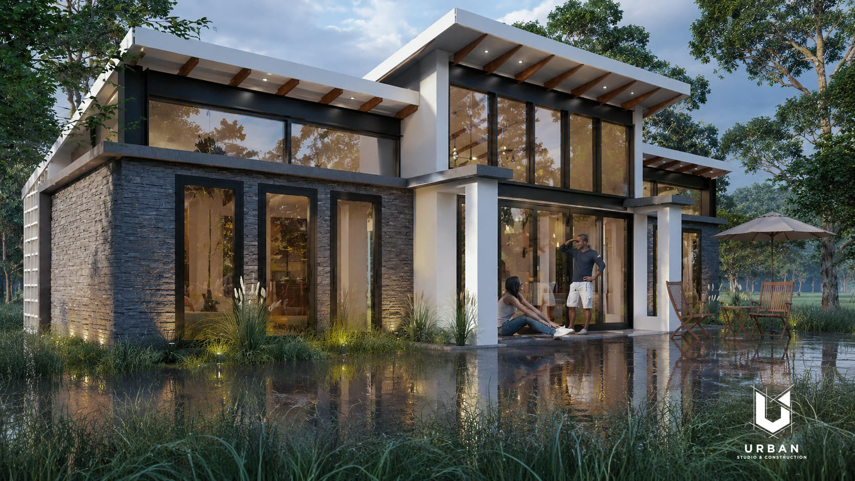 Luxury villa at dusk with glass walls and reflecting pool