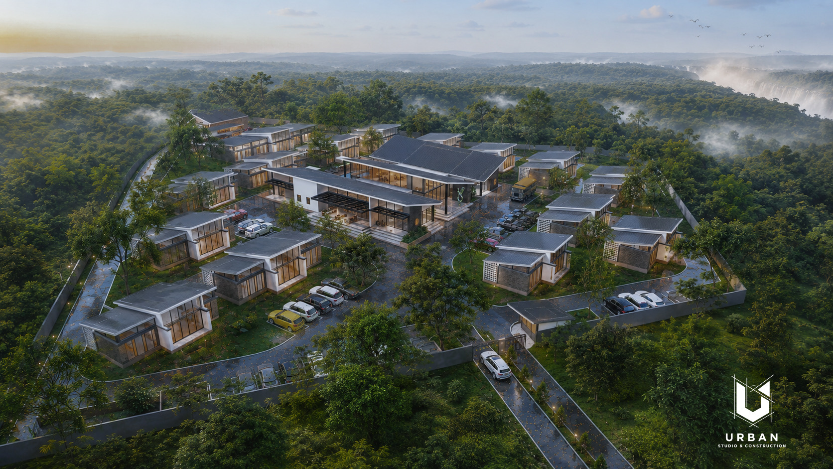Aerial view of the estate with villas set among misty forest near Victoria Falls